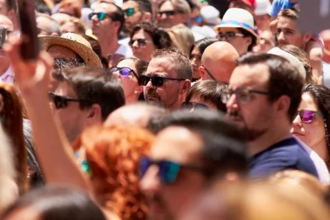 Man taking photos of the procession using mobile phone. Stock Photos