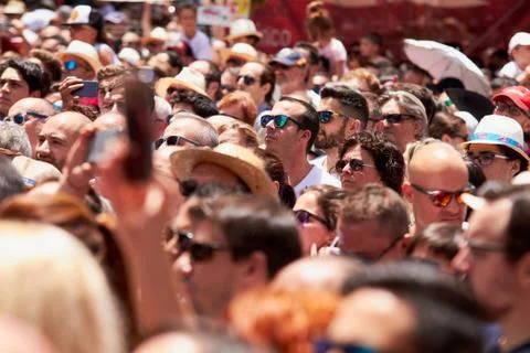 Man taking photos of the procession using mobile phone. Stock Photos