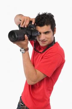 Man taking a picture with a digital camera Stock Photos