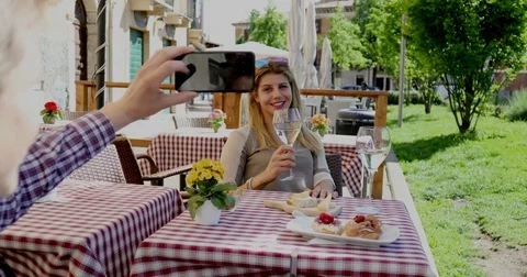Man taking a picture of his lovable girlfriend Stock Footage 75736206