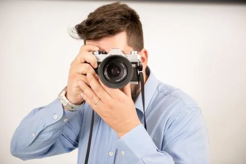 Man taking a picture with an old camera Stock Photos