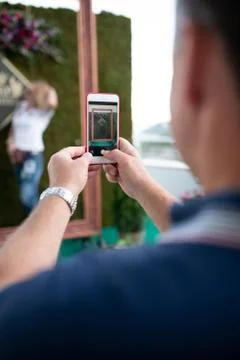 Man taking picture using smart phone Фото