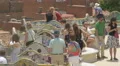 Man taking pictures on the main terrace of Park Guell, Barcelona 4k or 4k+ Resolution