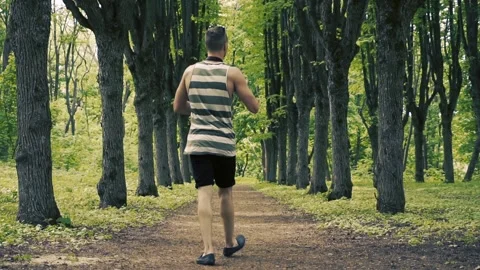 Man is taking pictures in the park Video stock 89493951