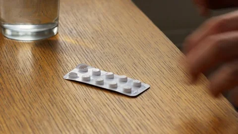 Man taking a pill Stock Footage 72544148