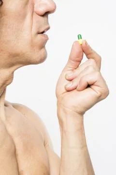 Man taking pill Stock Photos