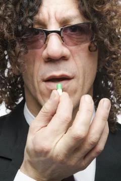 Man taking pill Stock Photos