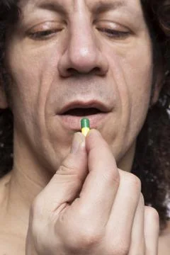 Man taking pill Stock Photos