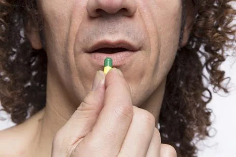 Man taking pill Stock Photos