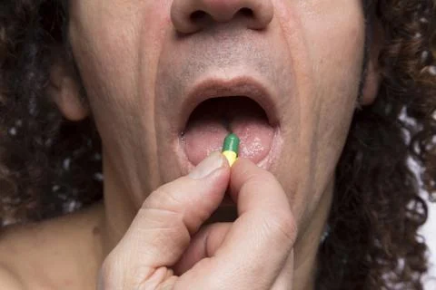 Man taking pill Stock Photos