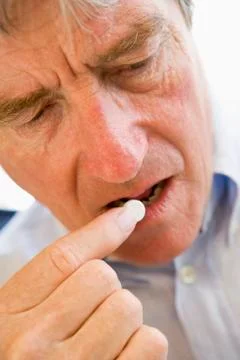 Man Taking Pills Stock Photos