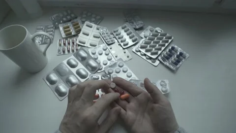 A man taking pills. Point of View Shot. POV video. Stock Footage 237941336