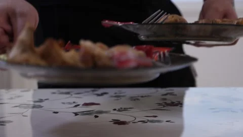 Man taking plates of food from the table Stock Footage 137211346