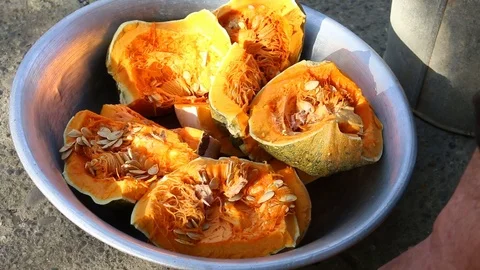 Man taking pumpkin to clean it from seeds Video stock 90193533