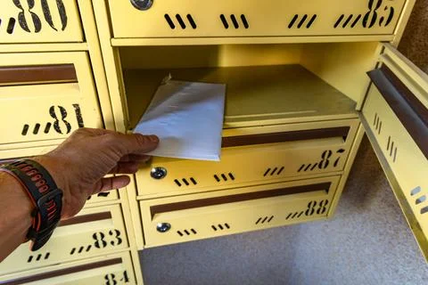 Man Taking a Registered Letter from Mailbox, Legal Notice or Court Summons Stock Photos