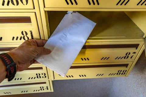 Man Taking a Registered Letter from Mailbox, Legal Notice or Court Summons Stock Photos