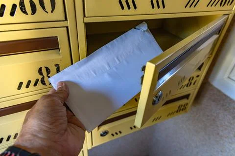 Man Taking a Registered Letter from Mailbox, Legal Notice or Court Summons Stock Photos