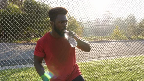 Man taking a rest break from his workout 動画素材 119310767