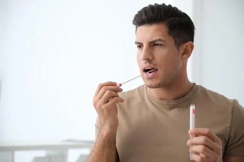 Man taking sample for DNA test indoors 스톡 사진