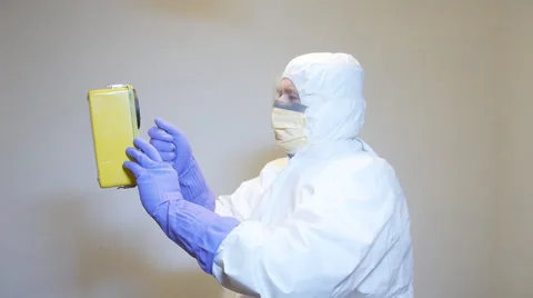 Man taking scanning room taking radioactivity radiation readings Stock Footage 60109866