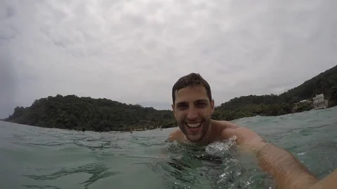 Man taking a selfie and having fun in a Beach in Brazil Stock Footage 71277117