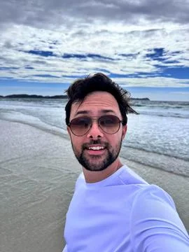 Man taking a selfie on the beach Stock Photos