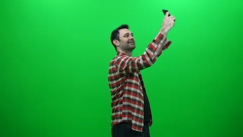 Man Taking A Selfie Photo With His Smartphone On A Green Screen Stock Footage 88656647