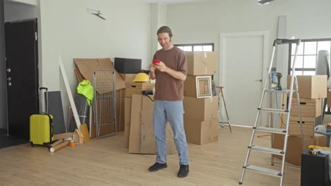 Man taking selfie with red smartphone while standing among packed moving bo.. Stock Footage 339191639