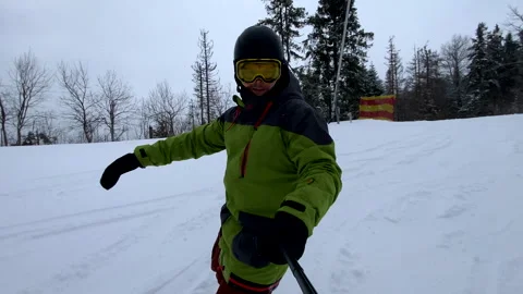 Man taking selfie riding down by hill Stock Footage 253387186