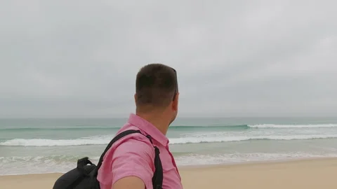 Man Taking Selfie on Sandy Beach by Atlantic Ocean in Portugal Stock Footage 308928735