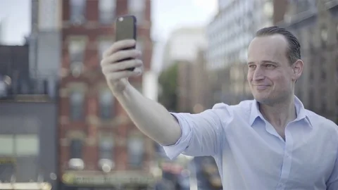 Man taking selfie with smart phone Stock Footage 75178502