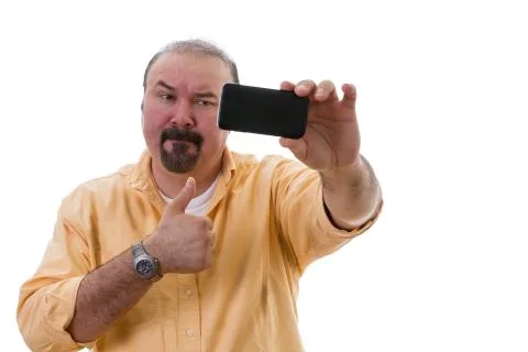 Man taking a selfie while giving a thumbs up Stock Photos