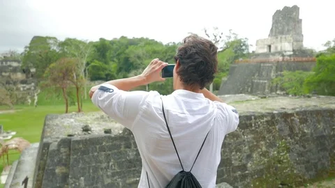 Man Taking a Shot of Mayan Temples Stock Footage 74904222
