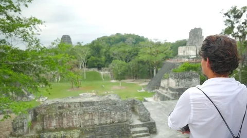 Man Taking a Shot of Mayan Temples Stock Footage 74904955