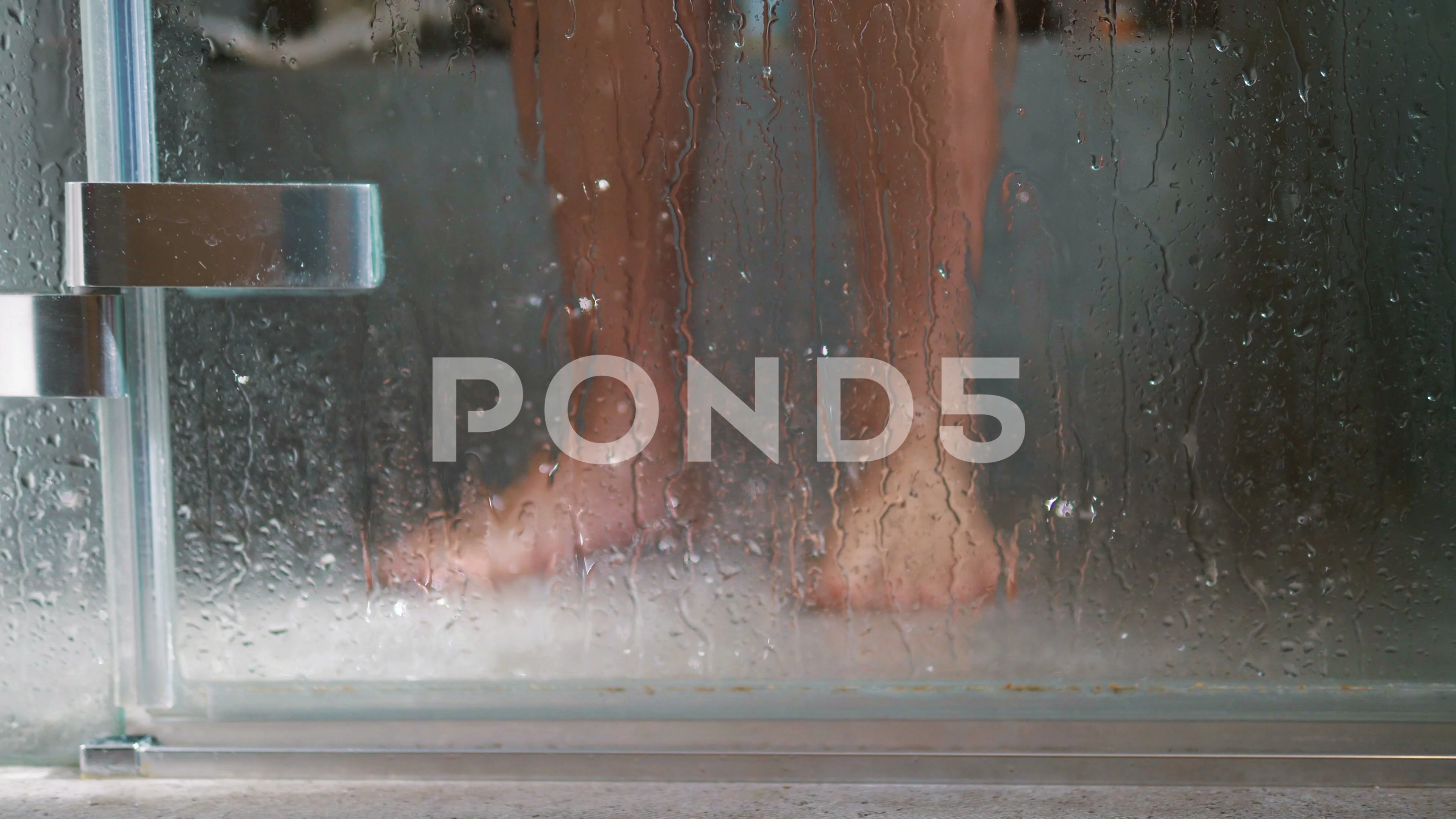 Man taking shower in 4k slow motion 60fp... | Stock Video | Pond5