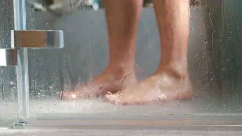 Man taking shower in 4k slow motion 60fps 스톡 동영상 99618300