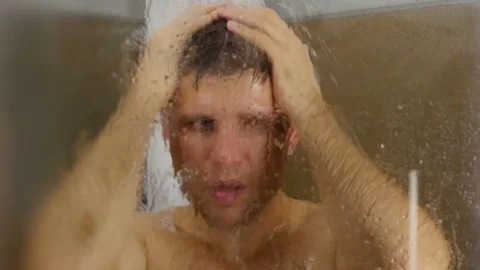 Man taking shower Video stock 69769295