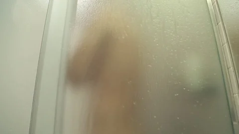 Man taking a shower Stock Footage 76479886