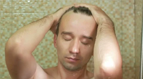 A man taking a shower at the hotel. For cleaning use a little soap from hotel Stock Footage 67521067