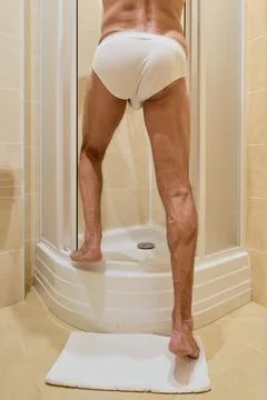 Man taking shower Stock Photos