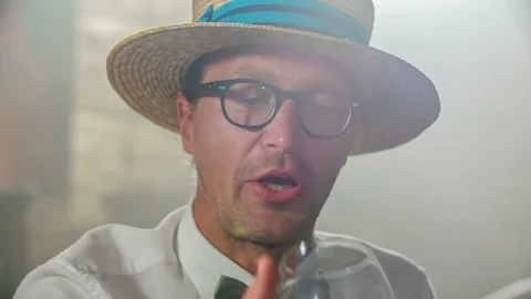 Man is taking a sip of the drink Stock Footage 112198531