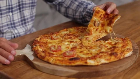 Man taking a slice of pizza Stock Footage 267985295