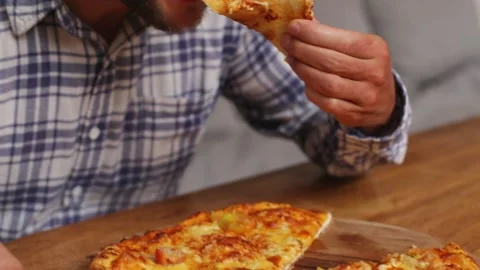 Man taking a slice of pizza Stock Footage 267985354