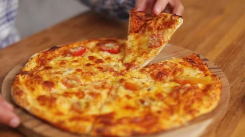 Man taking a slice of pizza Stock Footage 267985592