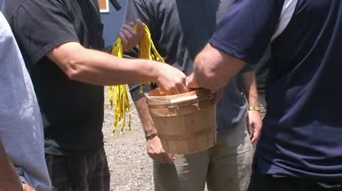 Man taking something from bucket Stock Footage 10829892