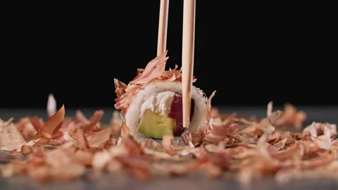 Man taking sushi using sticks. Somebody taking rolls in sushi restaurant. Stock Footage 151773536