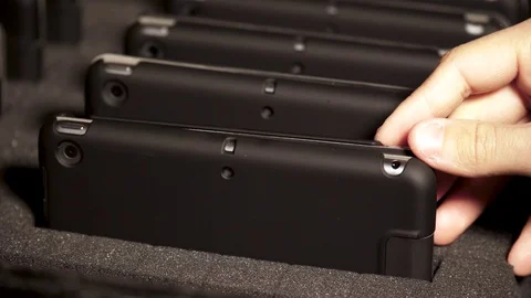 Man taking tablet out of tablet carrier  Stock Footage 104082409