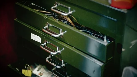 Man taking tool out from drawer Stock Footage