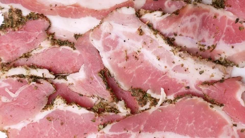 Man taking two slices of bacon. Stock Footage 70877500