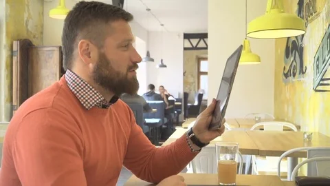 Man taking video call on internet app, skype, by tablet, profile, steadicam Vídeo Stock 73266684